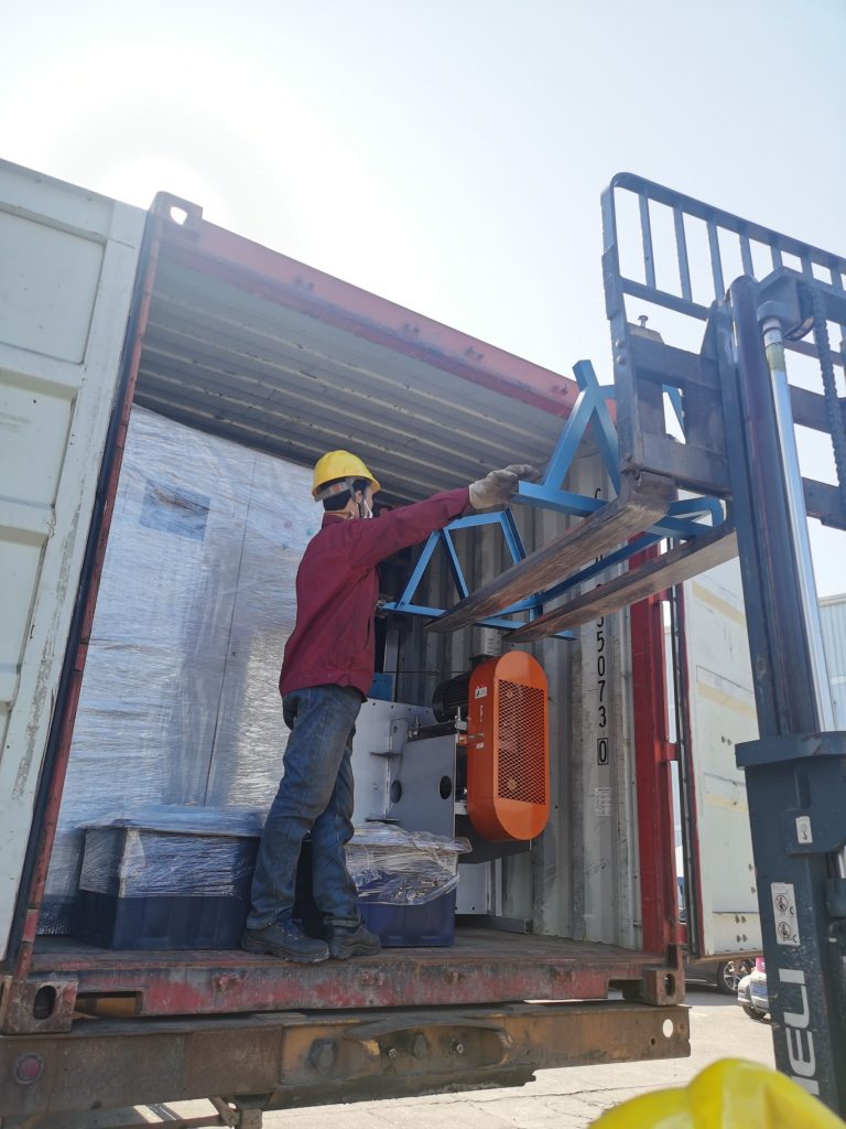 roto machine load in container